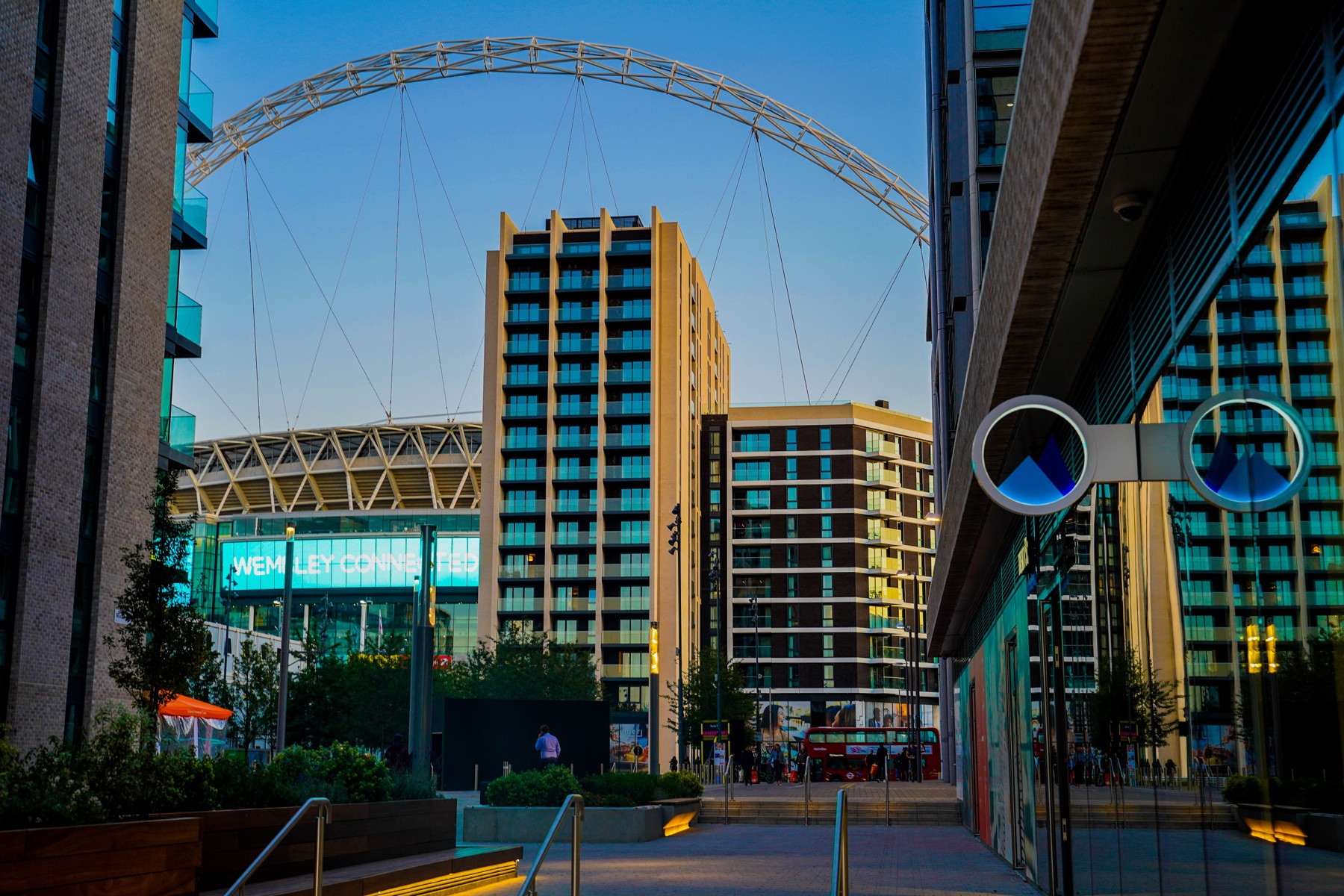 Wembley photographed beneath the stadium arch at dusk