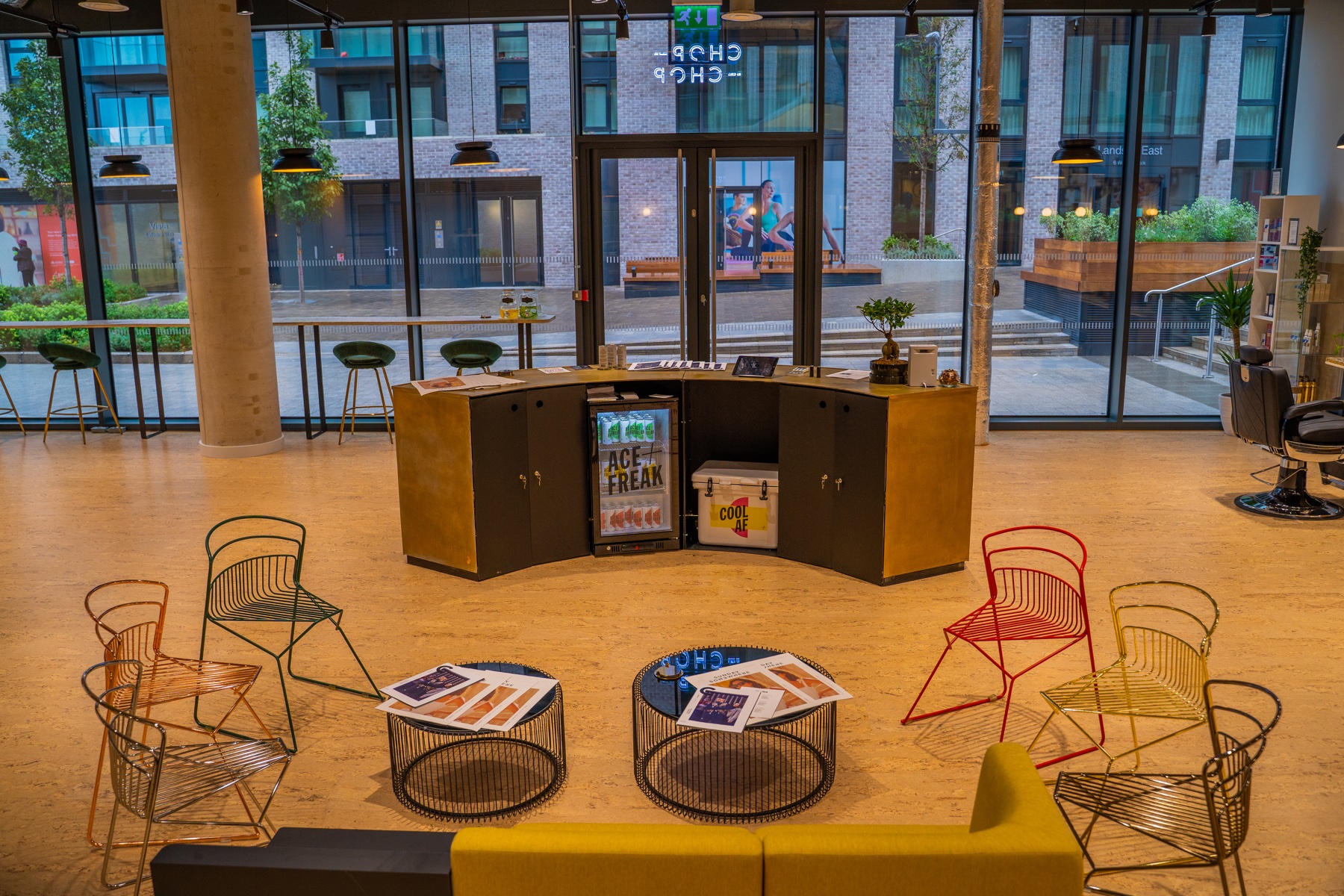 Commercial reception and seating area with full-height windows